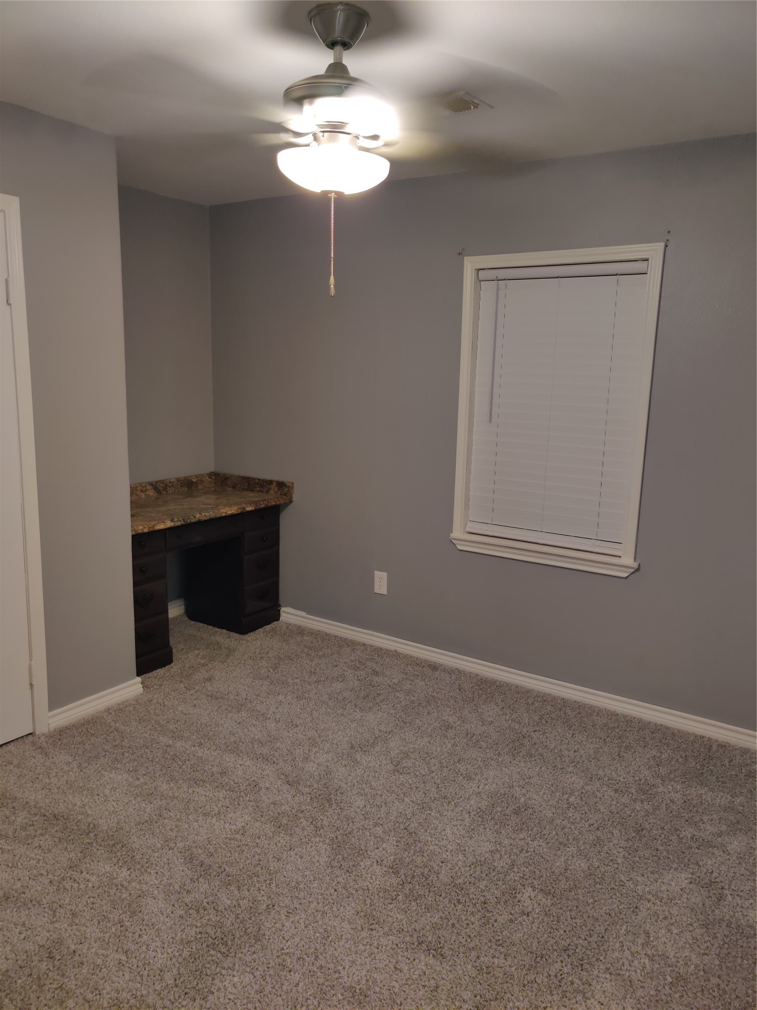 3314 Fern Street Pasadena, TX 77503 - Photo 14 of 14 a view of an empty room with a chandelier fan