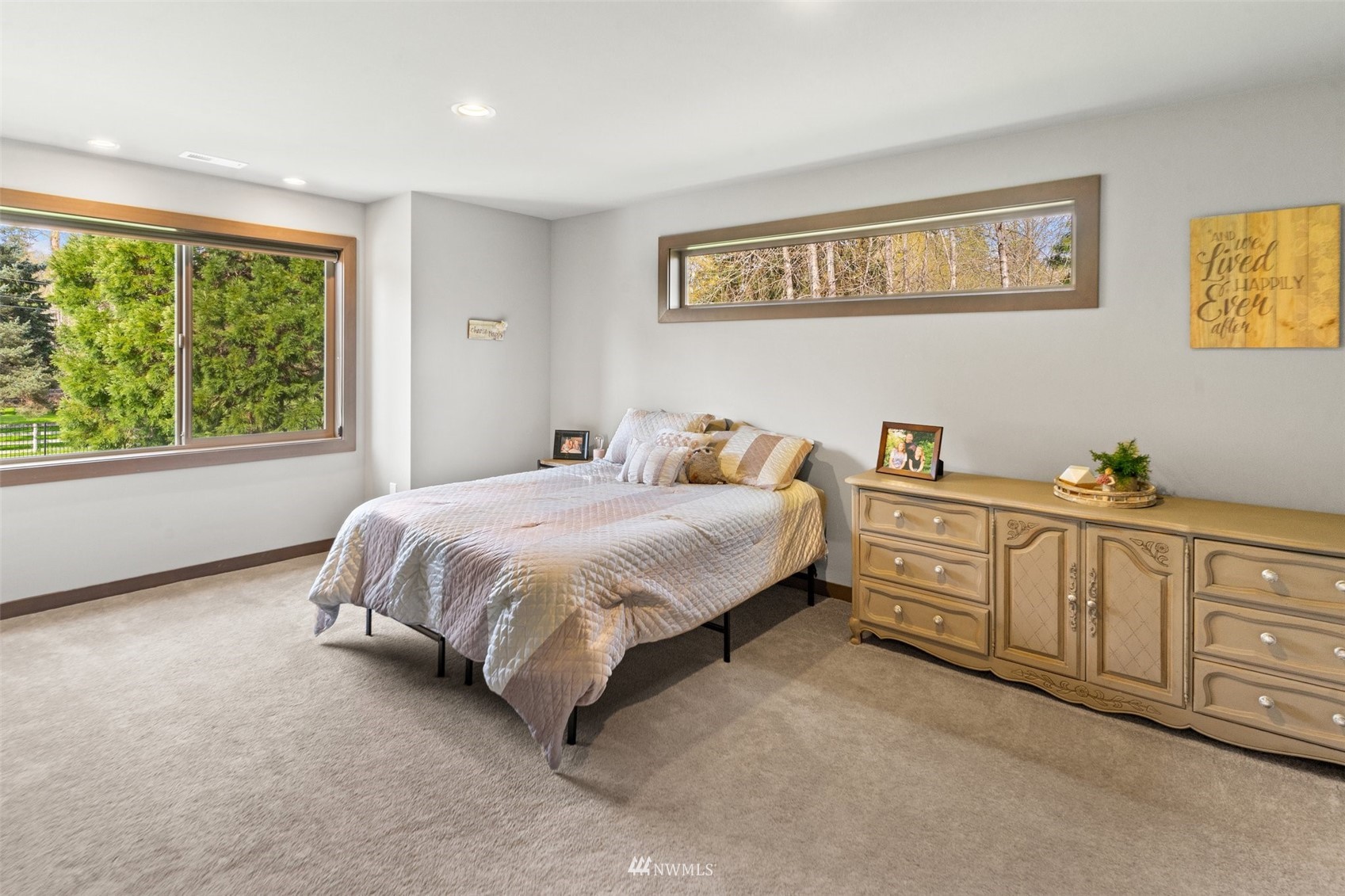 19129 43rd Avenue Southeast Bothell, WA 98012 - Photo 21 of 34 a spacious bedroom with a bed dresser and window