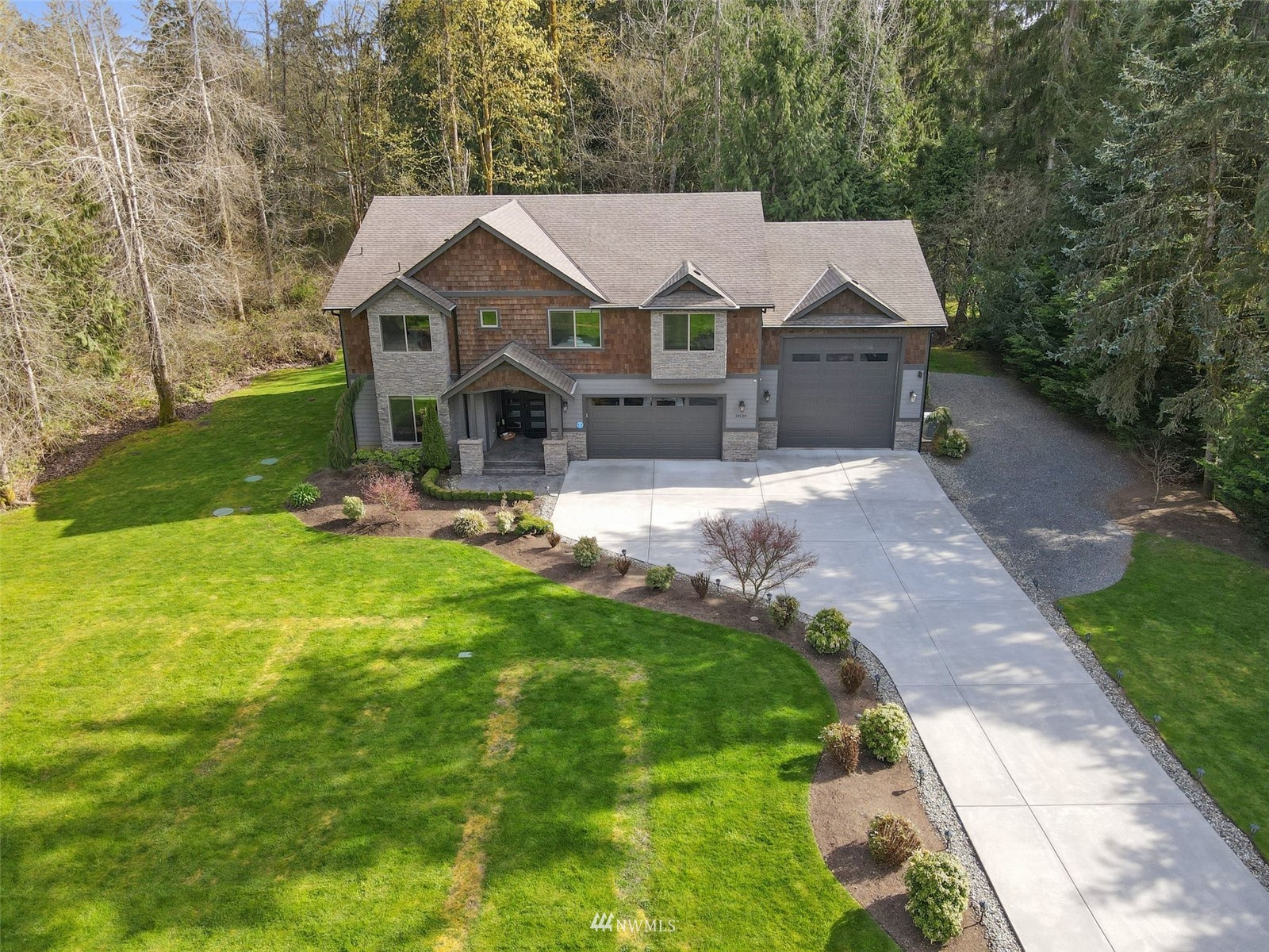 19129 43rd Avenue Southeast Bothell, WA 98012 - Photo 4 of 34 a front view of a house with garden
