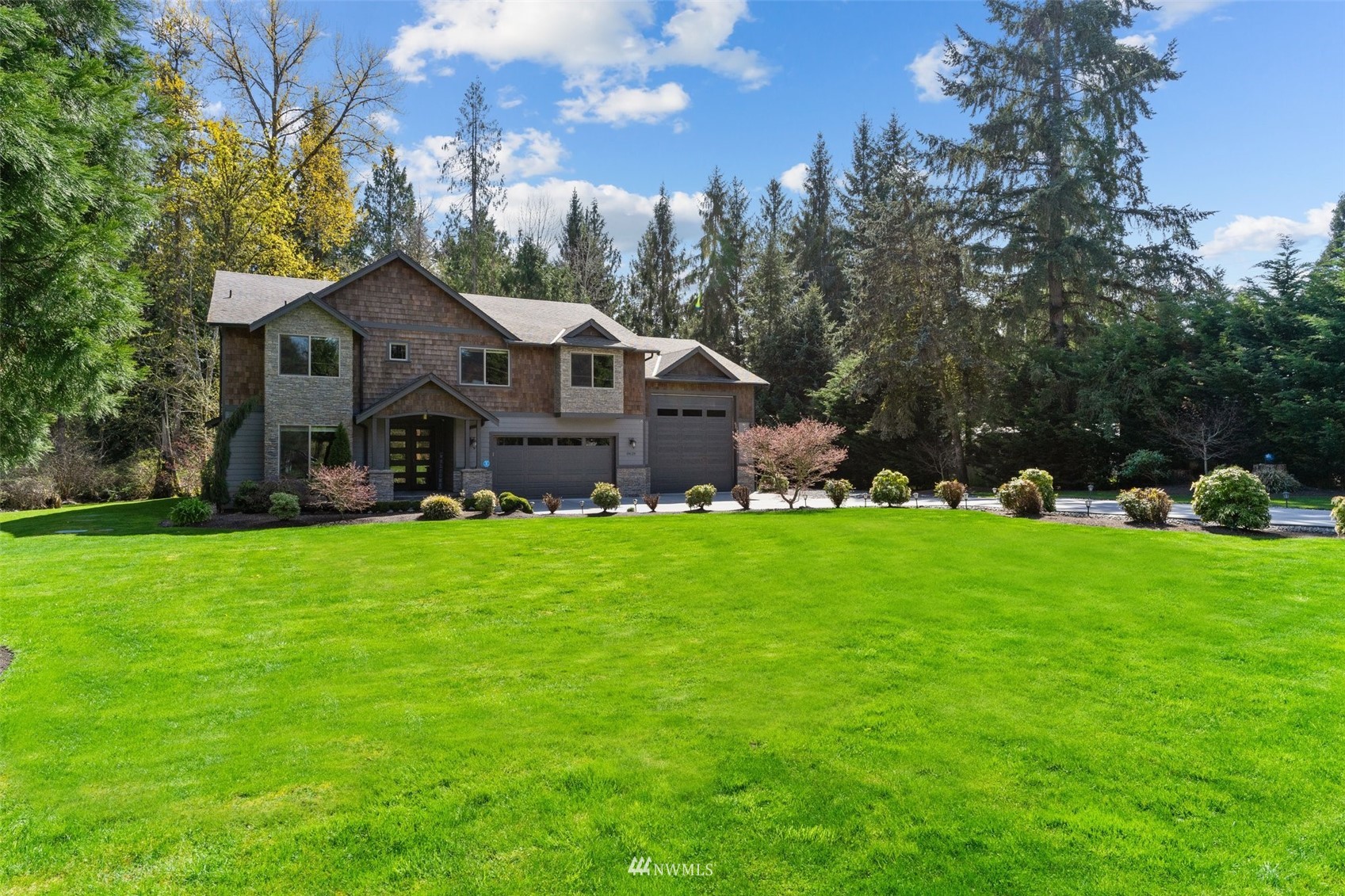 19129 43rd Avenue Southeast Bothell, WA 98012 - Photo 6 of 34 a front view of a house with garden