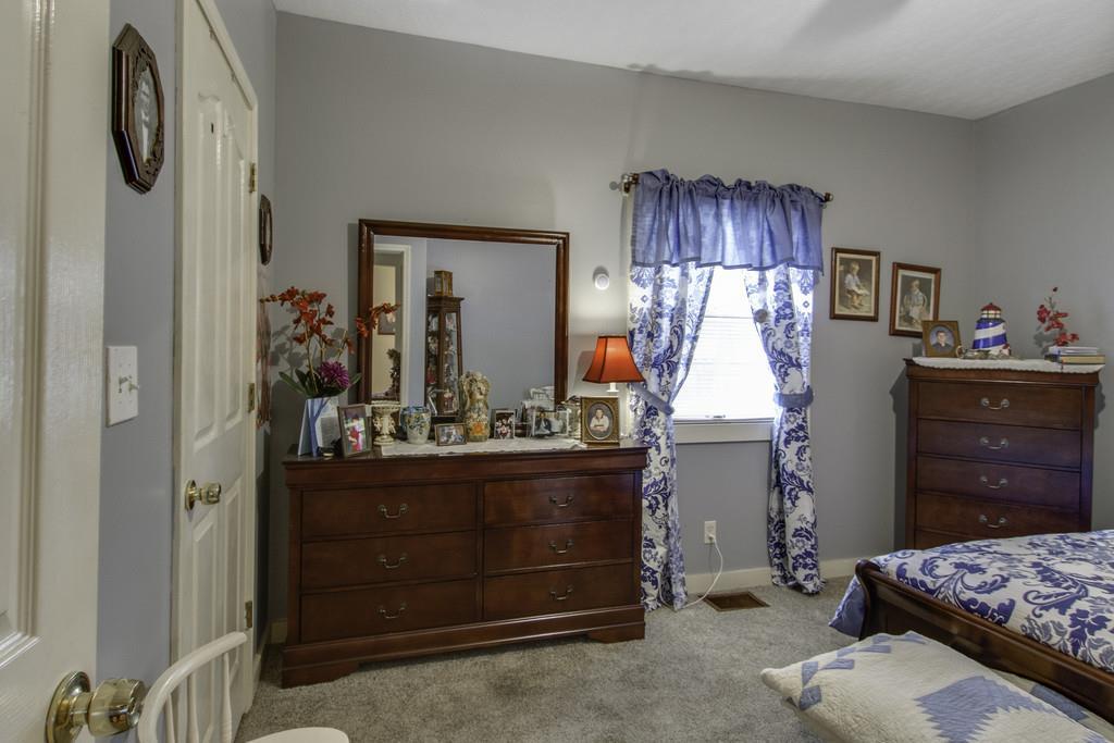 1708 South Main Street Springfield, TN 37172 - Photo 22 of 25 a bedroom with a bed and a dresser