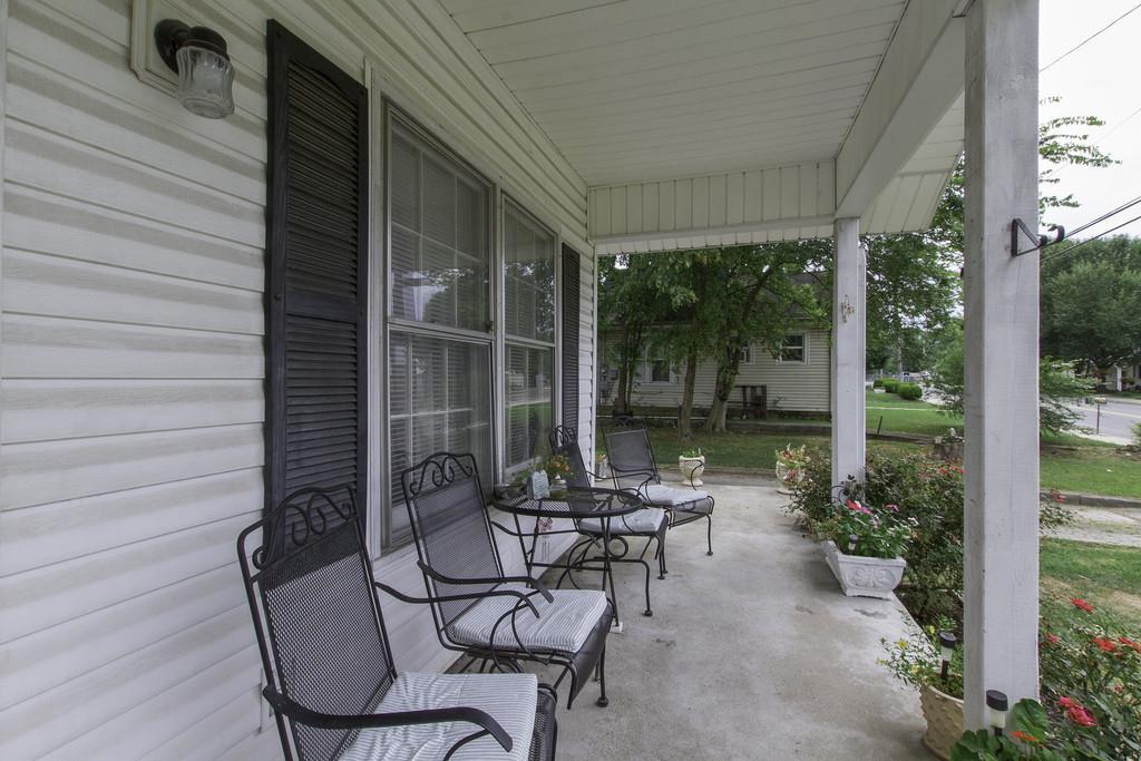 1708 South Main Street Springfield, TN 37172 - Photo 4 of 25 a view of a chair and table in patio with wooden fence