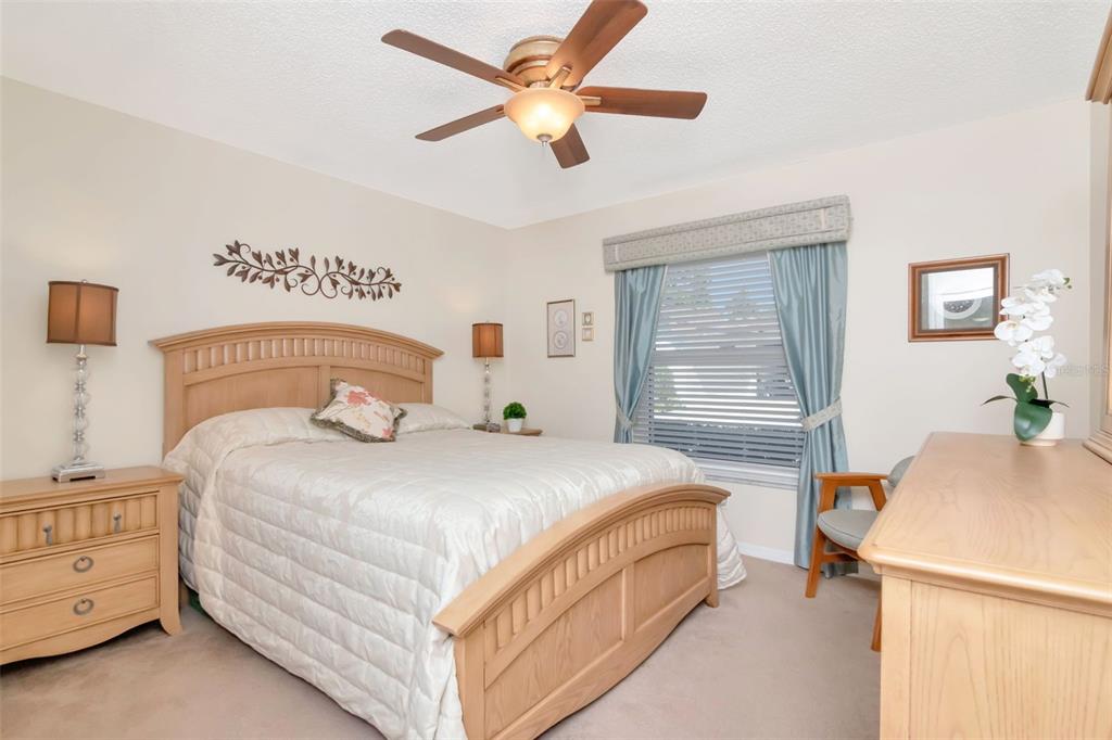 2281 Shelly Drive, Unit D Palm Harbor, FL 34684 - Photo 24 of 53 a bedroom with a bed and a table