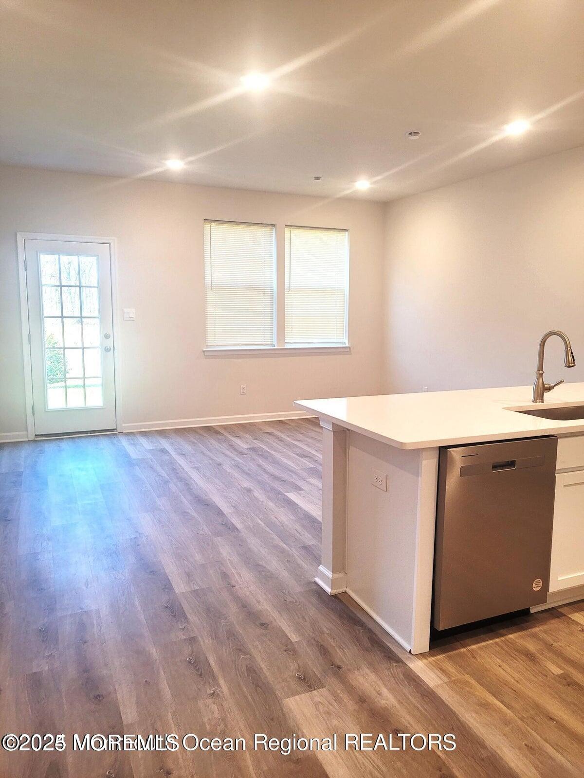 73 Nelsons Way Westampton, NJ 08060 - Photo 3 of 18 a room with a sink cabinets and wooden floor