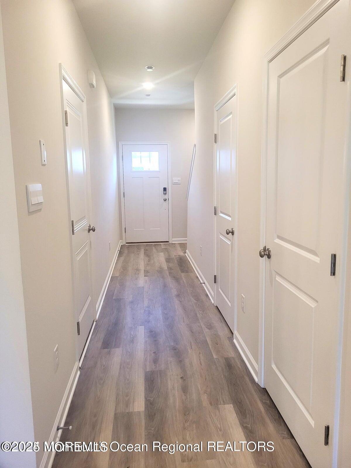 73 Nelsons Way Westampton, NJ 08060 - Photo 6 of 18 a view of a hallway with wooden floor and a bathroom