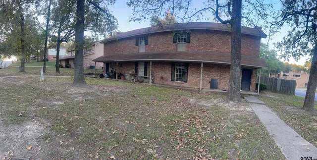 a front view of a house with yard