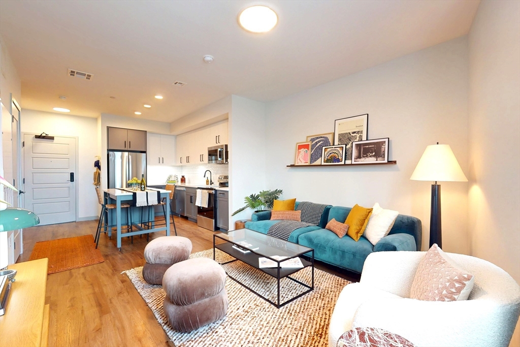 a living room with furniture and a table