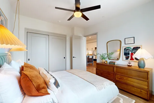 a bedroom with a bed and a dresser