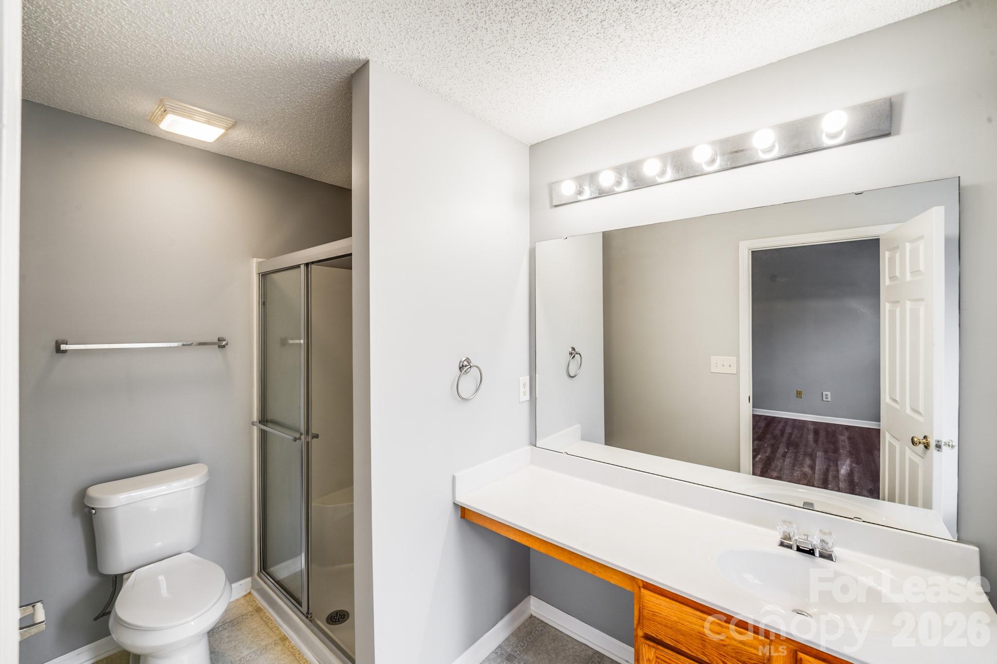 3260 Barons Court Road Charlotte, NC 28213 - Photo 20 of 25 a bathroom with a sink a toilet and shower