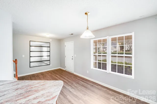 a view of empty room with windows