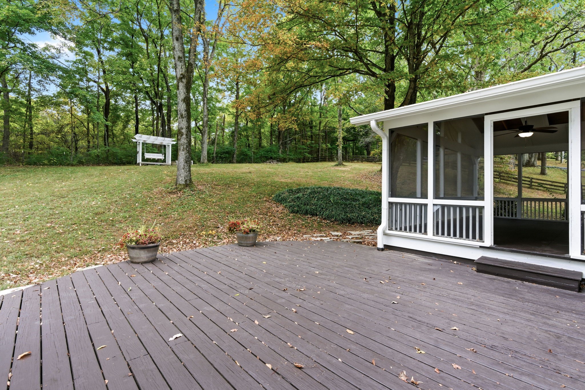305 Ridgewood Road Franklin, TN 37064 - Photo 17 of 25 a view of a deck with table and chairs and wooden floor