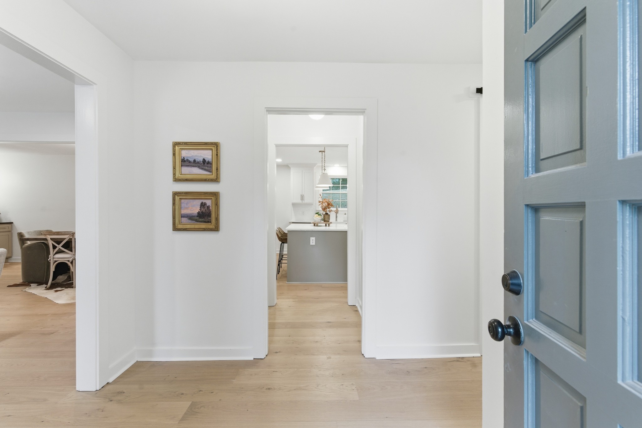 305 Ridgewood Road Franklin, TN 37064 - Photo 3 of 25 a view of a hallway with wooden floor and a living room