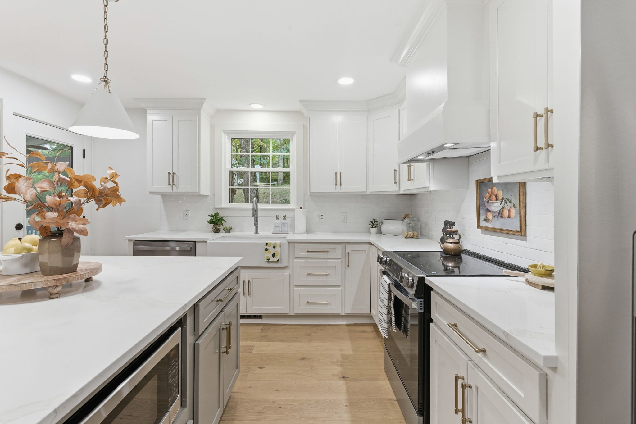 305 Ridgewood Road Franklin, TN 37064 - Photo 9 of 25 a kitchen with a sink stove and cabinets