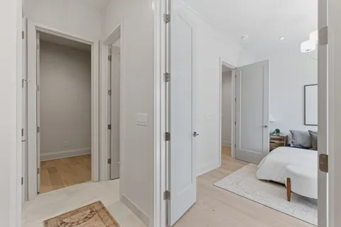 a bedroom with a bed and a mirror