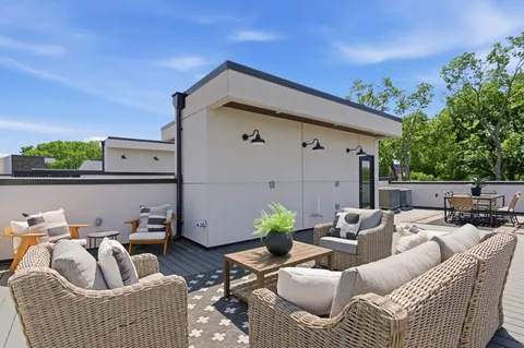 a outdoor living space with furniture and a potted plant