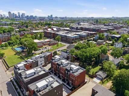 an aerial view of a city with lots of residential buildings