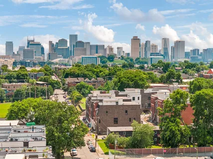 a view of a city with tall buildings