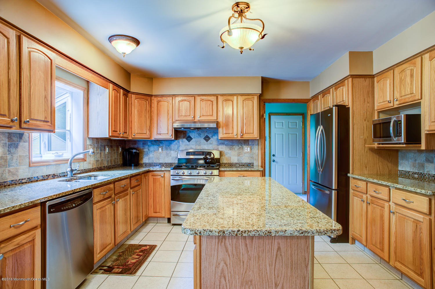 23 Rues Road Cream Ridge, NJ 08514 - Photo 11 of 45 a kitchen with stainless steel appliances granite countertop wooden cabinets a stove a sink and a dishwasher
