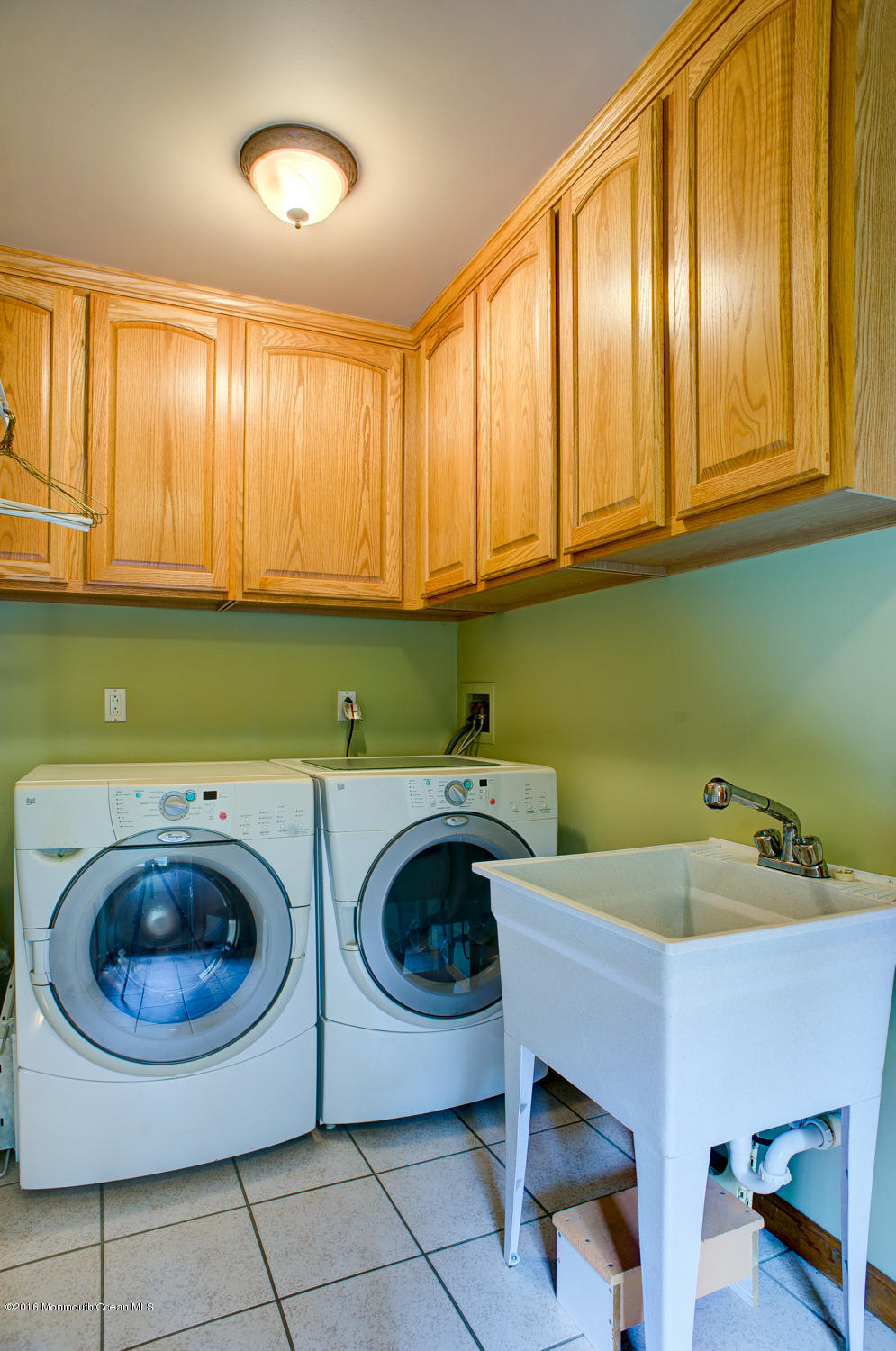23 Rues Road Cream Ridge, NJ 08514 - Photo 18 of 45 a kitchen with a sink a washer and dryer