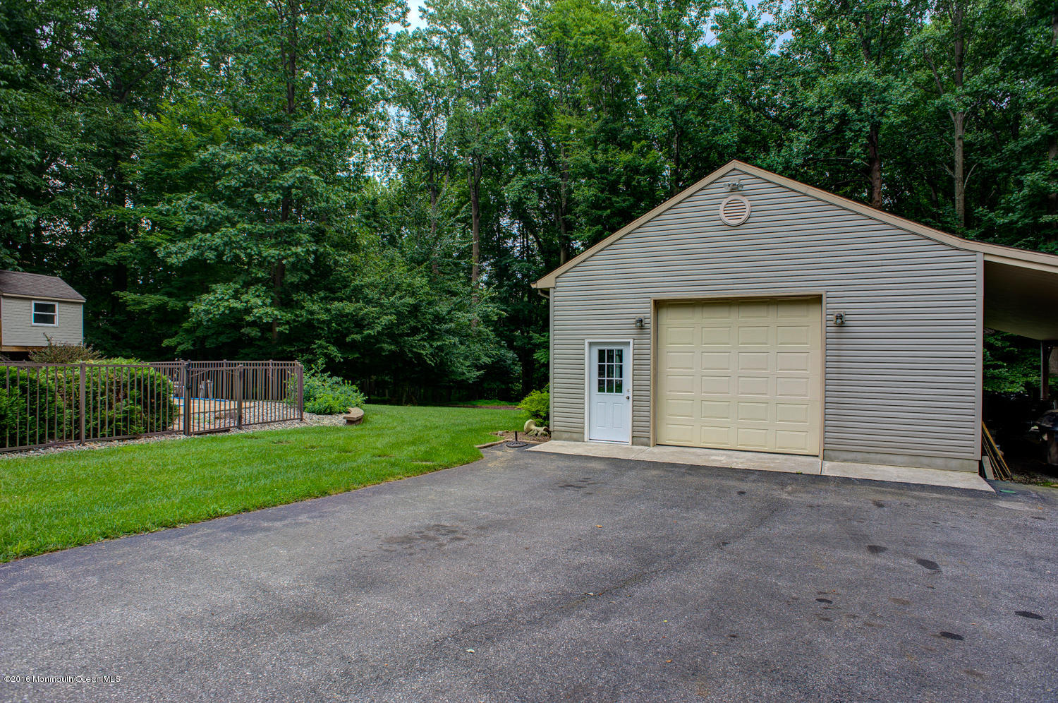 23 Rues Road Cream Ridge, NJ 08514 - Photo 43 of 45 a front view of a house with a yard and garage