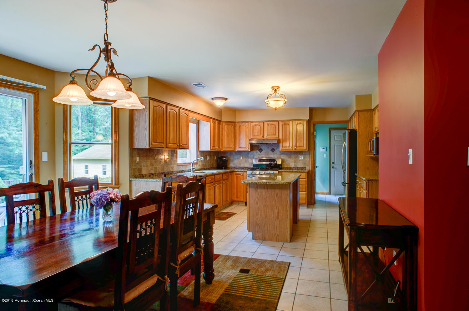 23 Rues Road Cream Ridge, NJ 08514 - Photo 10 of 45 a dining room with stainless steel appliances kitchen island granite countertop a table chairs and a living room