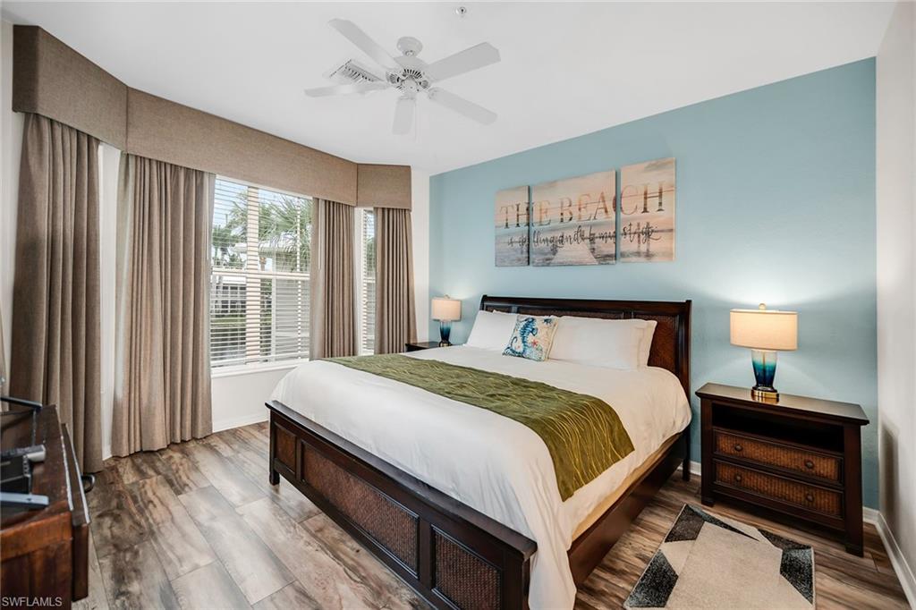 7930 Mahogany Run Lane, Unit 826 Naples, FL 34113 - Photo 16 of 50 a bedroom with a large bed and a window
