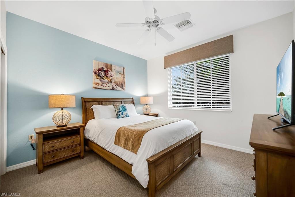 7930 Mahogany Run Lane, Unit 826 Naples, FL 34113 - Photo 22 of 50 a bed room with a bed and a couch