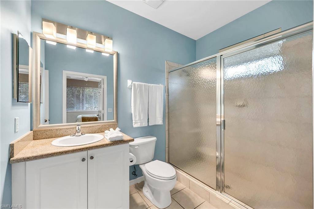 7930 Mahogany Run Lane, Unit 826 Naples, FL 34113 - Photo 24 of 50 a bathroom with a sink toilet and shower