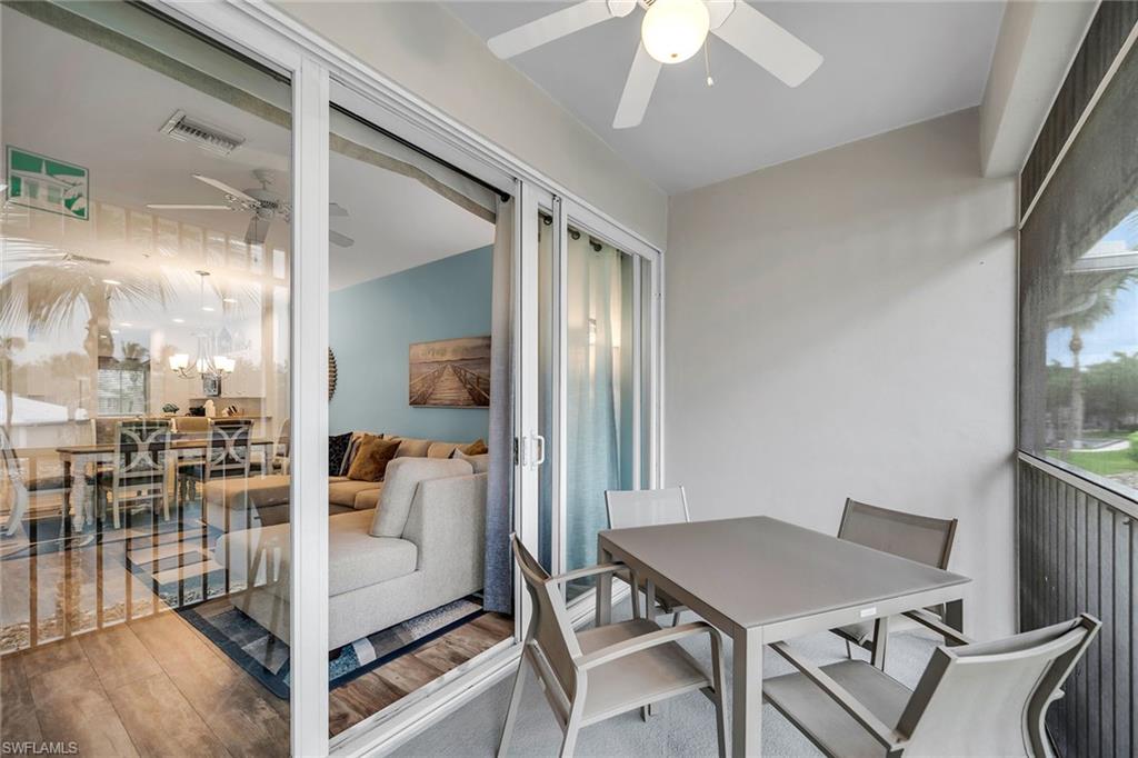 7930 Mahogany Run Lane, Unit 826 Naples, FL 34113 - Photo 28 of 50 a view of a dining room with furniture and a chandelier