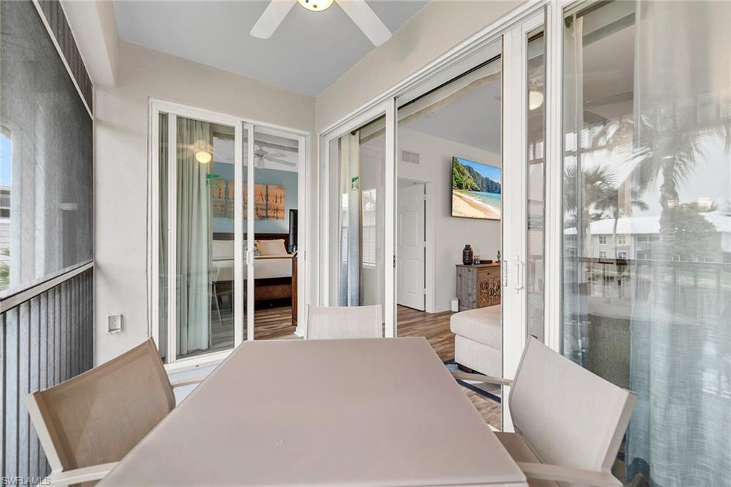 7930 Mahogany Run Lane, Unit 826 Naples, FL 34113 - Photo 29 of 50 a bedroom with furniture and a window