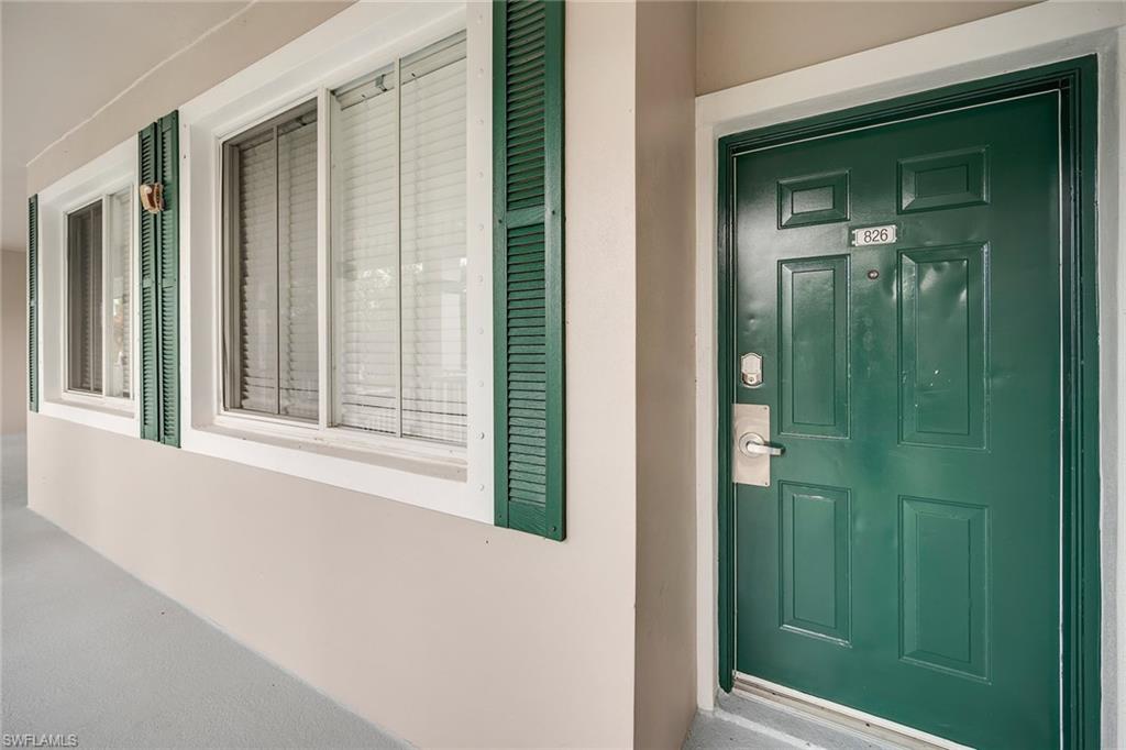 7930 Mahogany Run Lane, Unit 826 Naples, FL 34113 - Photo 30 of 50 a view of a door and a window