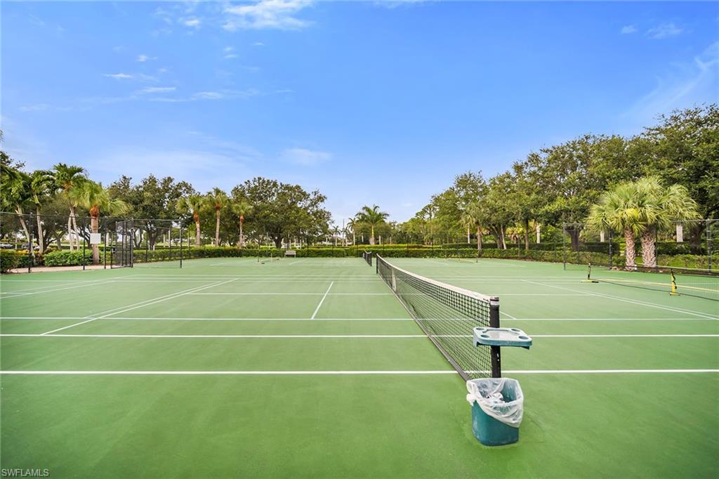 7930 Mahogany Run Lane, Unit 826 Naples, FL 34113 - Photo 36 of 50 a view of an outdoor space and tennis court