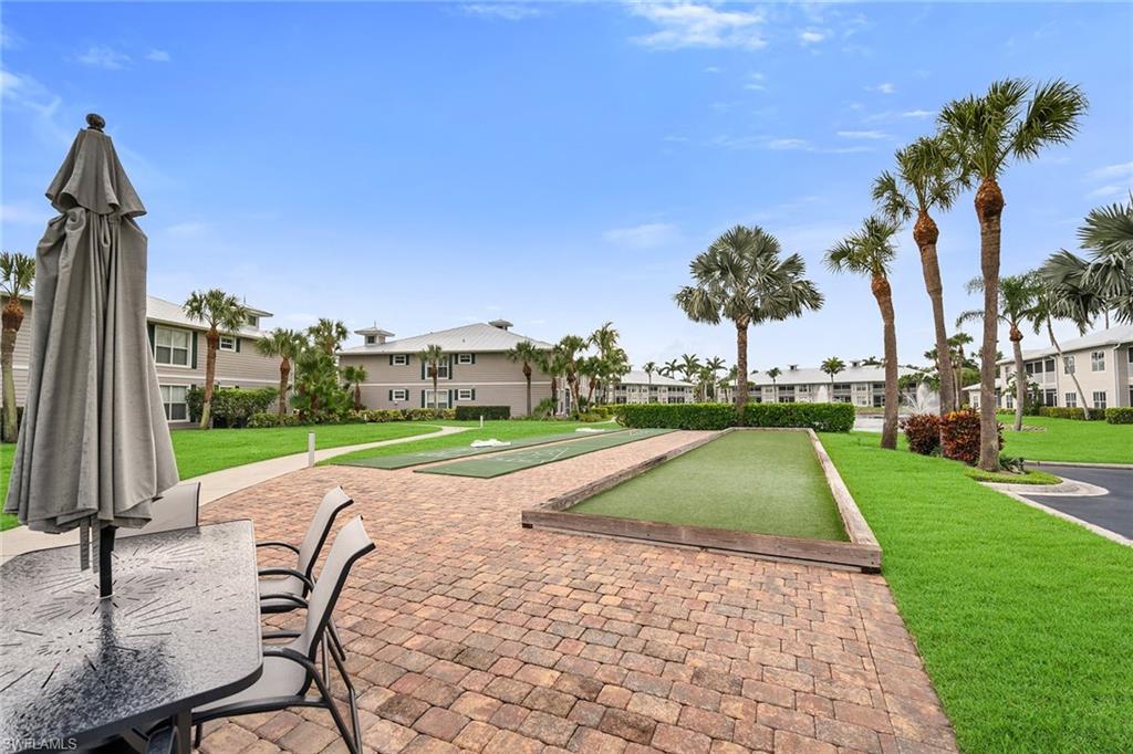 7930 Mahogany Run Lane, Unit 826 Naples, FL 34113 - Photo 37 of 50 a view of outdoor space patio and lake view
