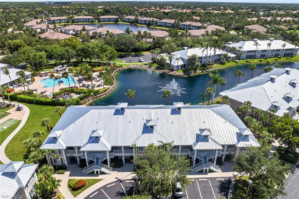 7930 Mahogany Run Lane, Unit 826 Naples, FL 34113 - Photo 38 of 50 an aerial view of a house with a lake view