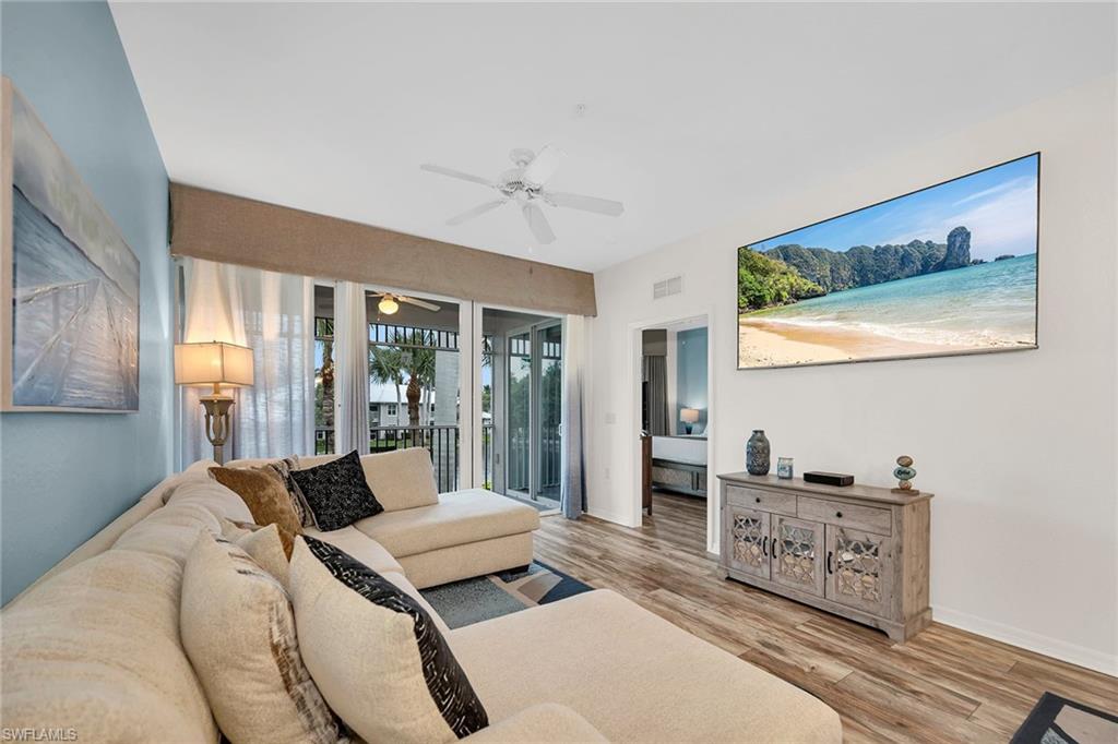 7930 Mahogany Run Lane, Unit 826 Naples, FL 34113 - Photo 4 of 50 a bedroom with furniture and large windows