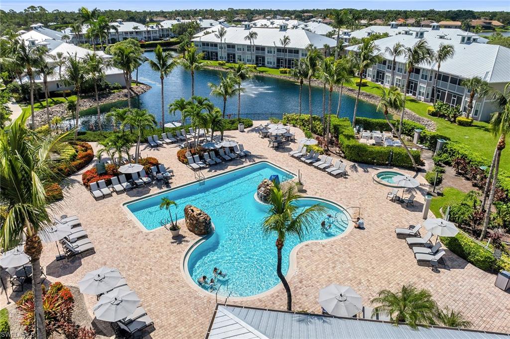 7930 Mahogany Run Lane, Unit 826 Naples, FL 34113 - Photo 42 of 50 an aerial view of a house with a yard and lake view