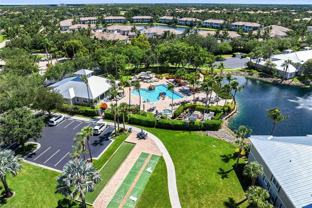 7930 Mahogany Run Lane, Unit 826 Naples, FL 34113 - Photo 43 of 50 an aerial view of a house with a garden and lake view
