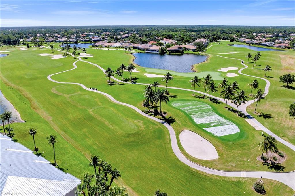 7930 Mahogany Run Lane, Unit 826 Naples, FL 34113 - Photo 46 of 50 a view of a swimming pool and a lake
