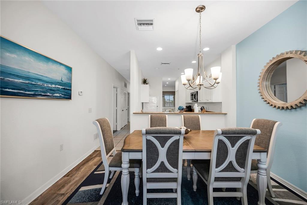 7930 Mahogany Run Lane, Unit 826 Naples, FL 34113 - Photo 48 of 50 a view of a dining room with furniture