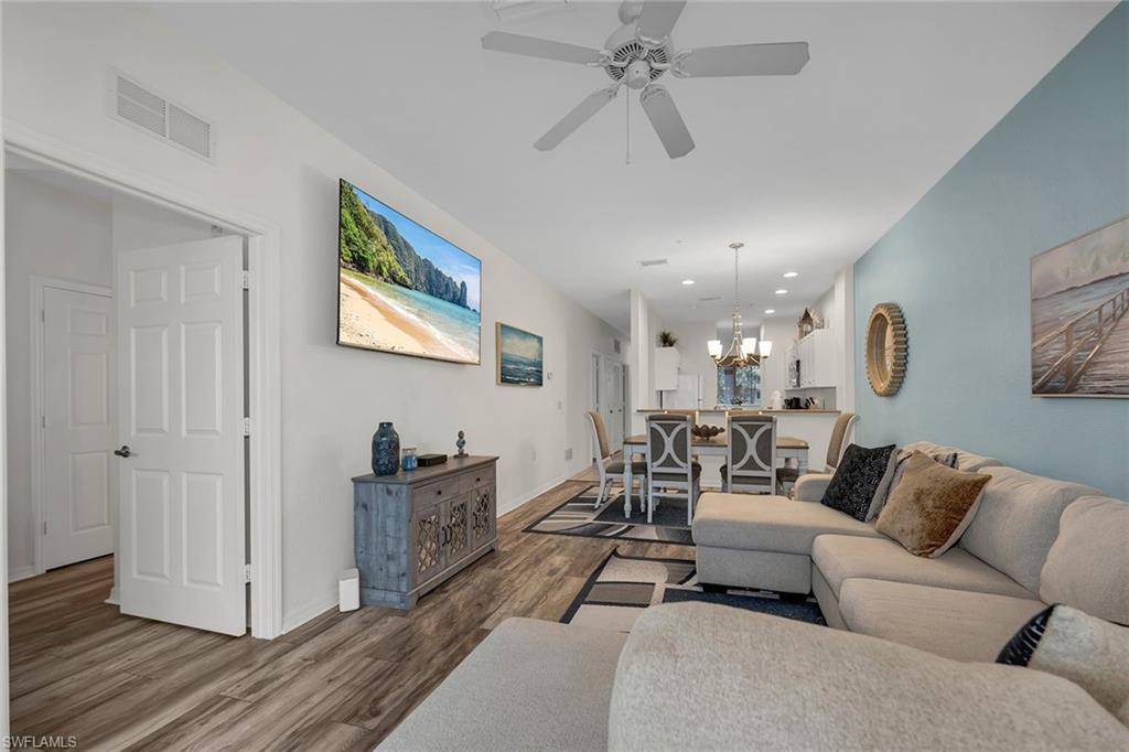 7930 Mahogany Run Lane, Unit 826 Naples, FL 34113 - Photo 6 of 50 a living room with furniture and a ceiling fan