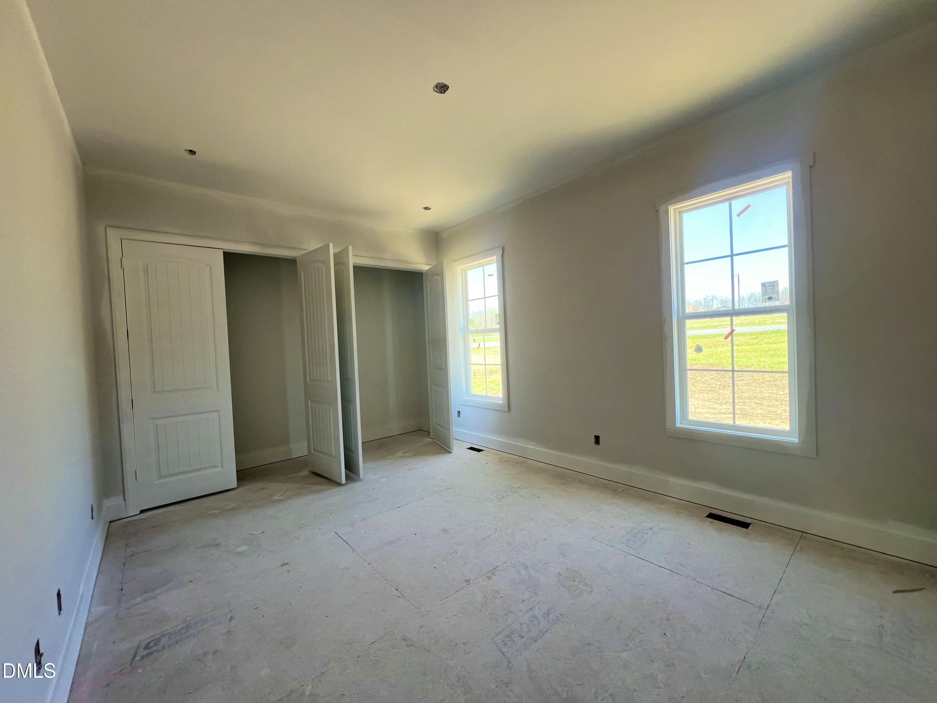 8755 Snow Camp Road Snow Camp, NC 27349 - Photo 21 of 28 an empty room with windows