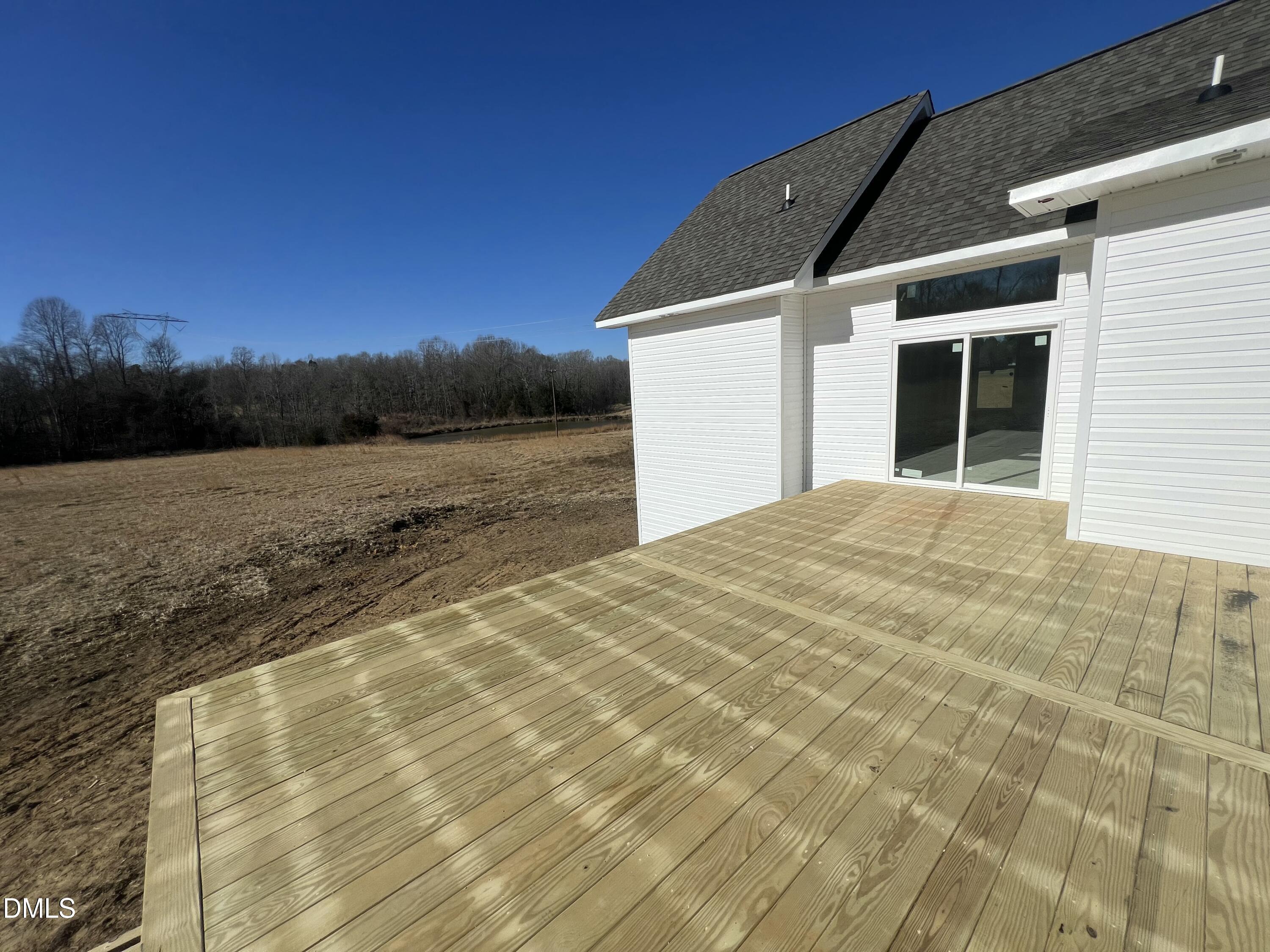 8755 Snow Camp Road Snow Camp, NC 27349 - Photo 6 of 28 a view of a white house with a yard