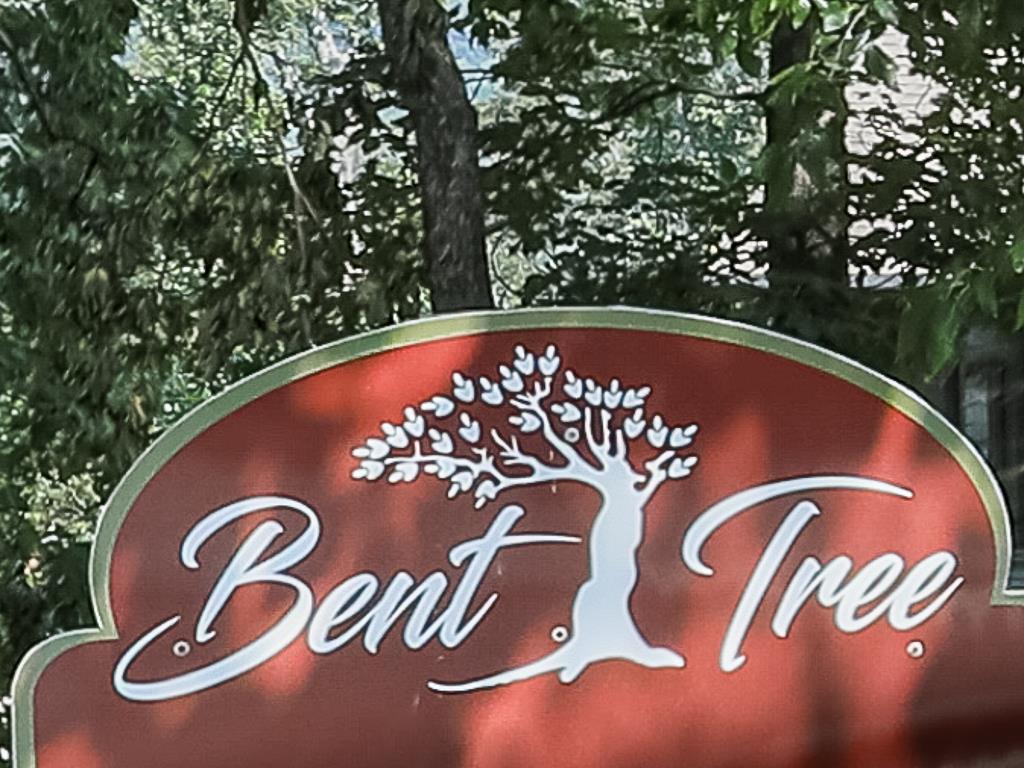 617 Crippled Oak Trail Jasper, GA 30143 - Photo 33 of 45 a blue sign that is sitting on the tracks