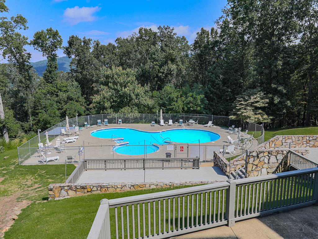 617 Crippled Oak Trail Jasper, GA 30143 - Photo 34 of 45 a lawn chairs and table under an umbrella