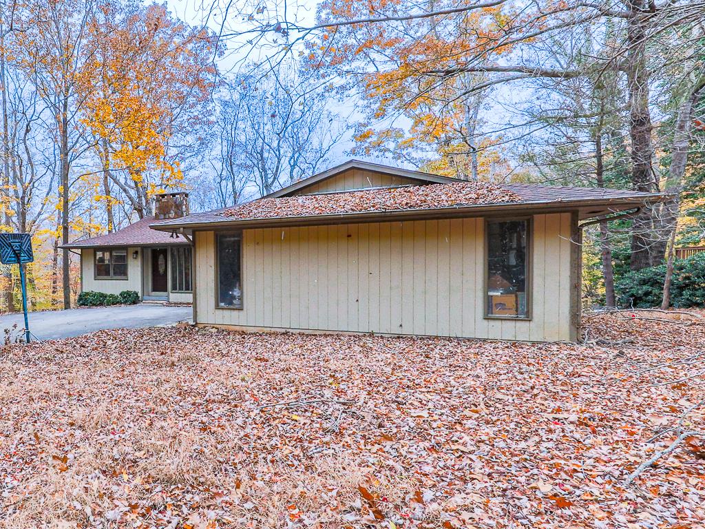 617 Crippled Oak Trail Jasper, GA 30143 - Photo 39 of 45 a front view of a house with a garden