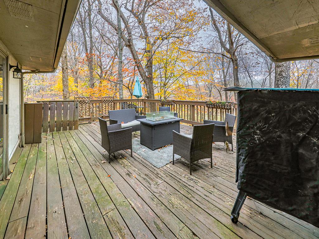 617 Crippled Oak Trail Jasper, GA 30143 - Photo 43 of 45 a balcony with wooden floor and furniture