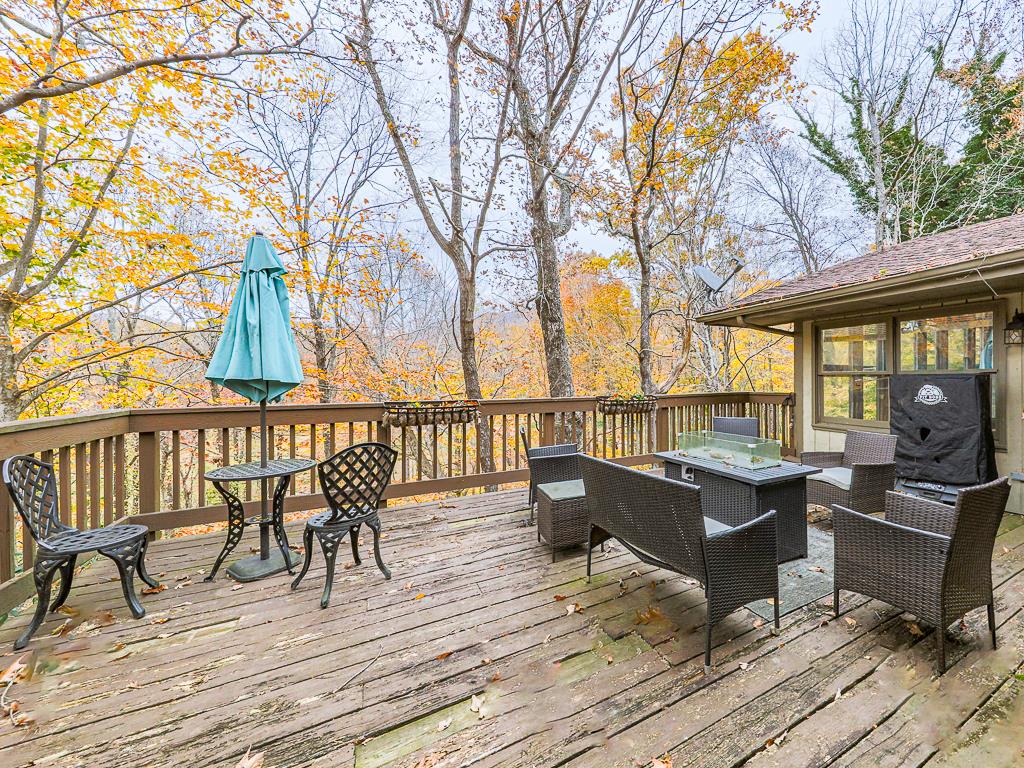 617 Crippled Oak Trail Jasper, GA 30143 - Photo 45 of 45 a view of a balcony with wooden floor and outdoor seating