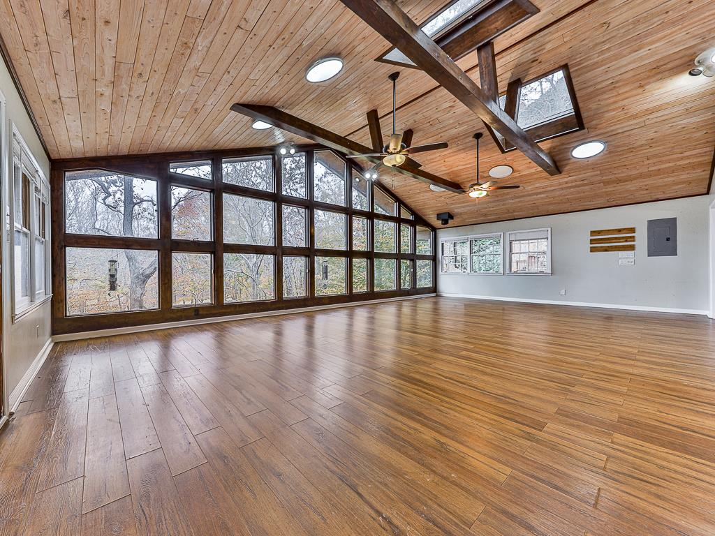 617 Crippled Oak Trail Jasper, GA 30143 - Photo 7 of 45 a view of an empty room with wooden floor and a window