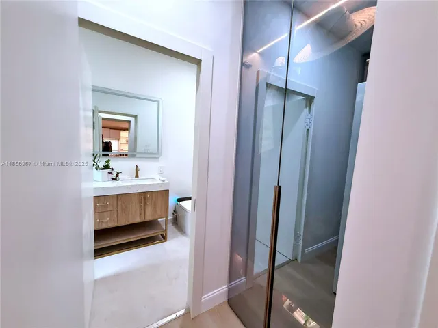 a bathroom with a sink and a mirror