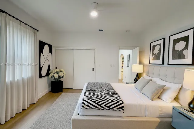 a bedroom with a bed and a couch